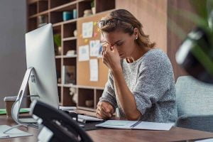 Woman thinking about working a full time job and mental health